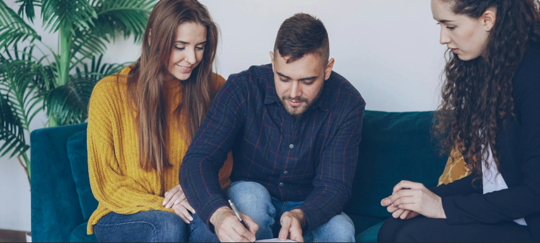 couple signing a prenup